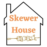 House with skewer of meat logo